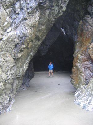 Kathy explores a sea cave at low tide